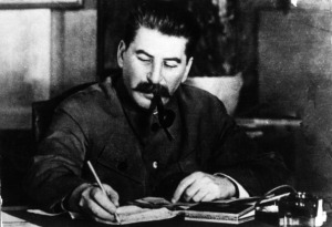 Joseph Stalin smoking his pipe at his desk. (Getty)